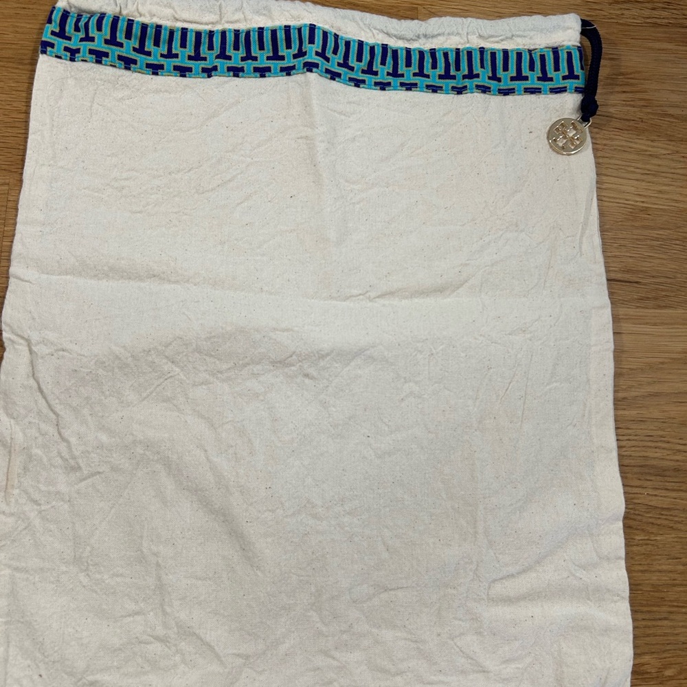 Tory Burch Cream Dustbag with Blue acqua and ocre trim.